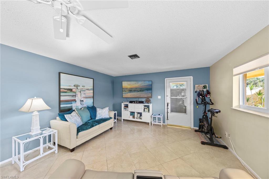 180 Harrison Road, Unit G4 Naples, FL 34112 - Photo 14 of 46 a bedroom with furniture and a window