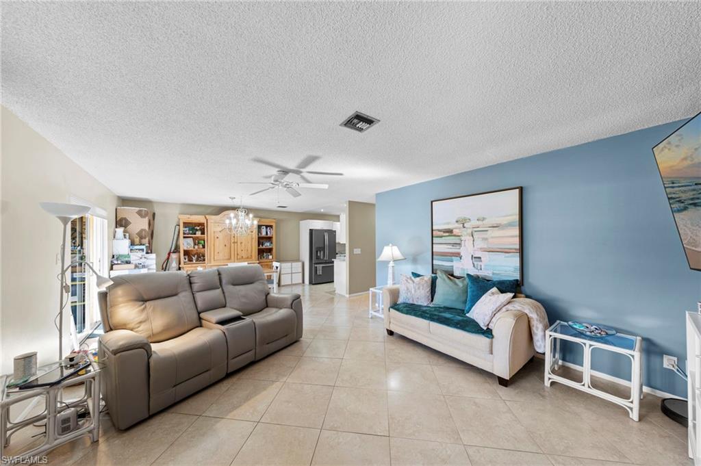 180 Harrison Road, Unit G4 Naples, FL 34112 - Photo 20 of 46 a living room with furniture and a couch