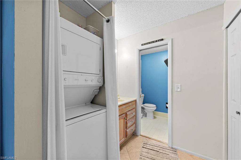 180 Harrison Road, Unit G4 Naples, FL 34112 - Photo 27 of 46 a bathroom with a toilet and a shower