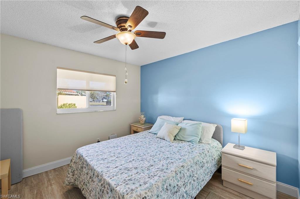180 Harrison Road, Unit G4 Naples, FL 34112 - Photo 28 of 46 a bedroom with a bed and a window