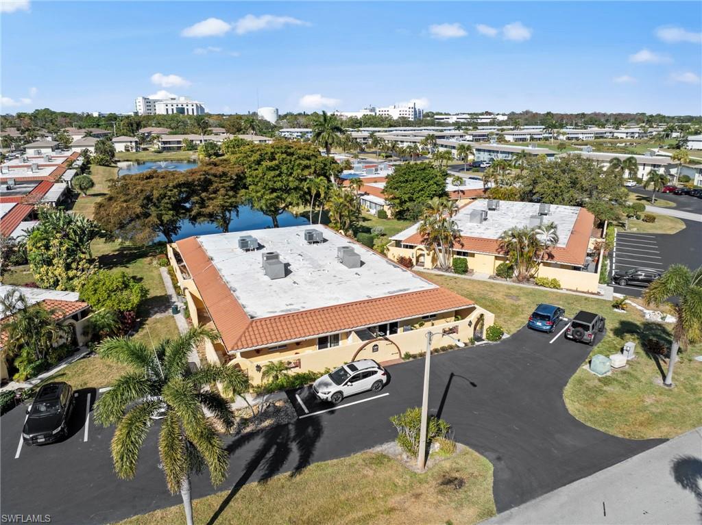 180 Harrison Road, Unit G4 Naples, FL 34112 - Photo 30 of 46 a view of a terrace with furniture