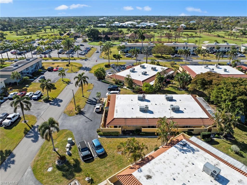 180 Harrison Road, Unit G4 Naples, FL 34112 - Photo 33 of 46 an aerial view of a houses with a swimming pool