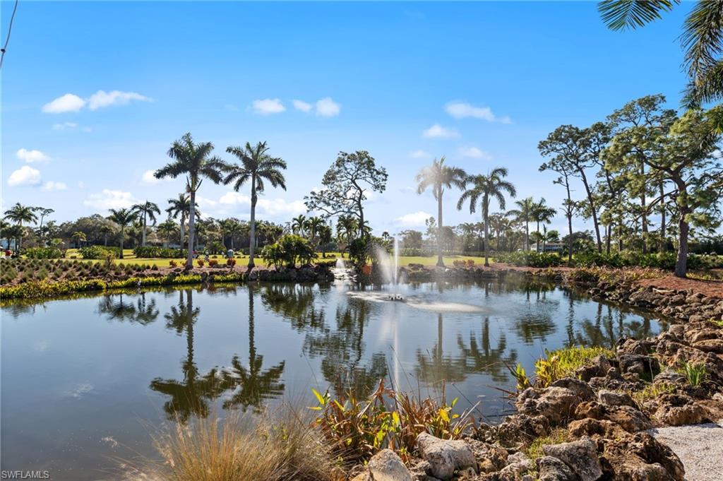 180 Harrison Road, Unit G4 Naples, FL 34112 - Photo 39 of 46 a view of a lake with boats and trees