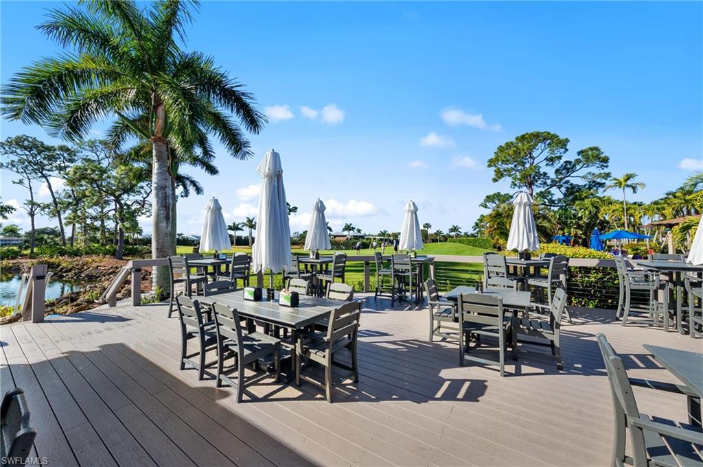 180 Harrison Road, Unit G4 Naples, FL 34112 - Photo 40 of 46 a view of a patio with swimming pool