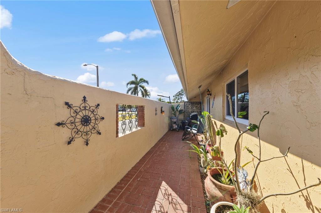 180 Harrison Road, Unit G4 Naples, FL 34112 - Photo 10 of 46 a very nice looking room with a white bed