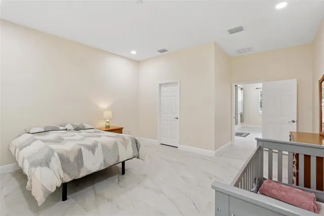 a bed room with a bed and a window