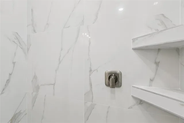 a view of a house with backyard and tree