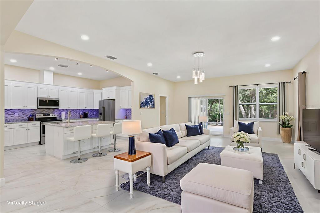 33433 Loop Court Webster, FL 33597 - Photo 8 of 69 a living room with furniture and a large window