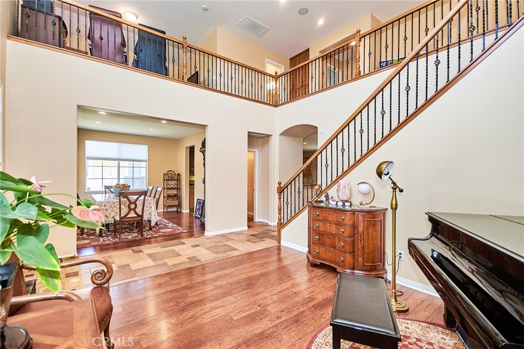 12430 Split Rein Drive Rancho Cucamonga, CA 91739 - Photo 12 of 29 a view of entryway and hall with wooden floor