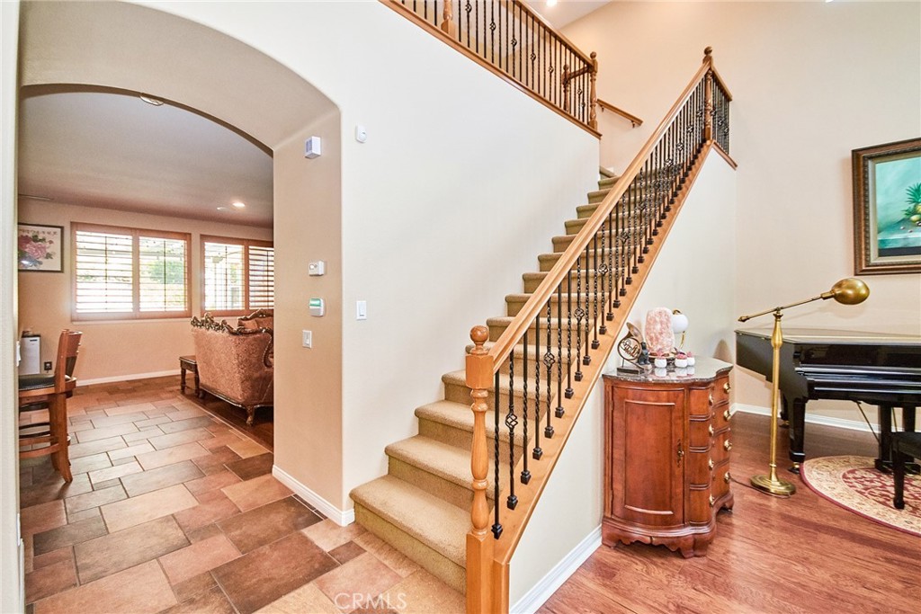 12430 Split Rein Drive Rancho Cucamonga, CA 91739 - Photo 13 of 29 a view of entryway and hall with wooden floor