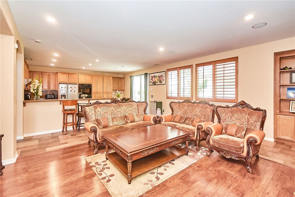 12430 Split Rein Drive Rancho Cucamonga, CA 91739 - Photo 17 of 29 a living room with furniture and a table