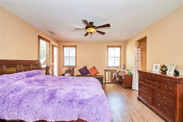 a bed room with a bed and a dresser