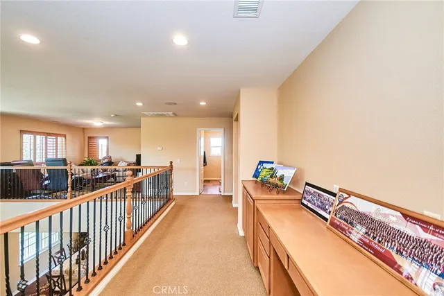 a view of a room with furniture and windows