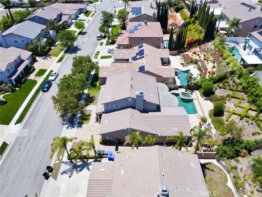 12430 Split Rein Drive Rancho Cucamonga, CA 91739 - Photo 27 of 29 an aerial view of a house with a yard and garden