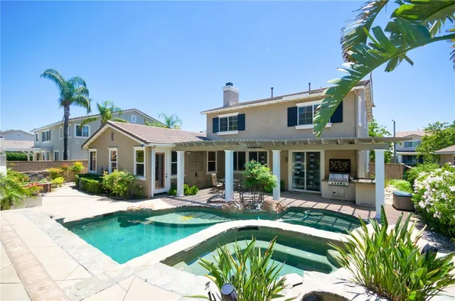 a front view of house with yard and outdoor seating