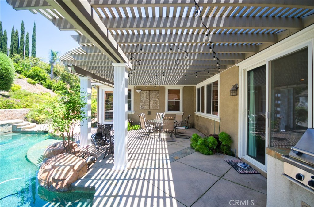12430 Split Rein Drive Rancho Cucamonga, CA 91739 - Photo 9 of 29 a view of a patio with couches table and chairs and potted plants