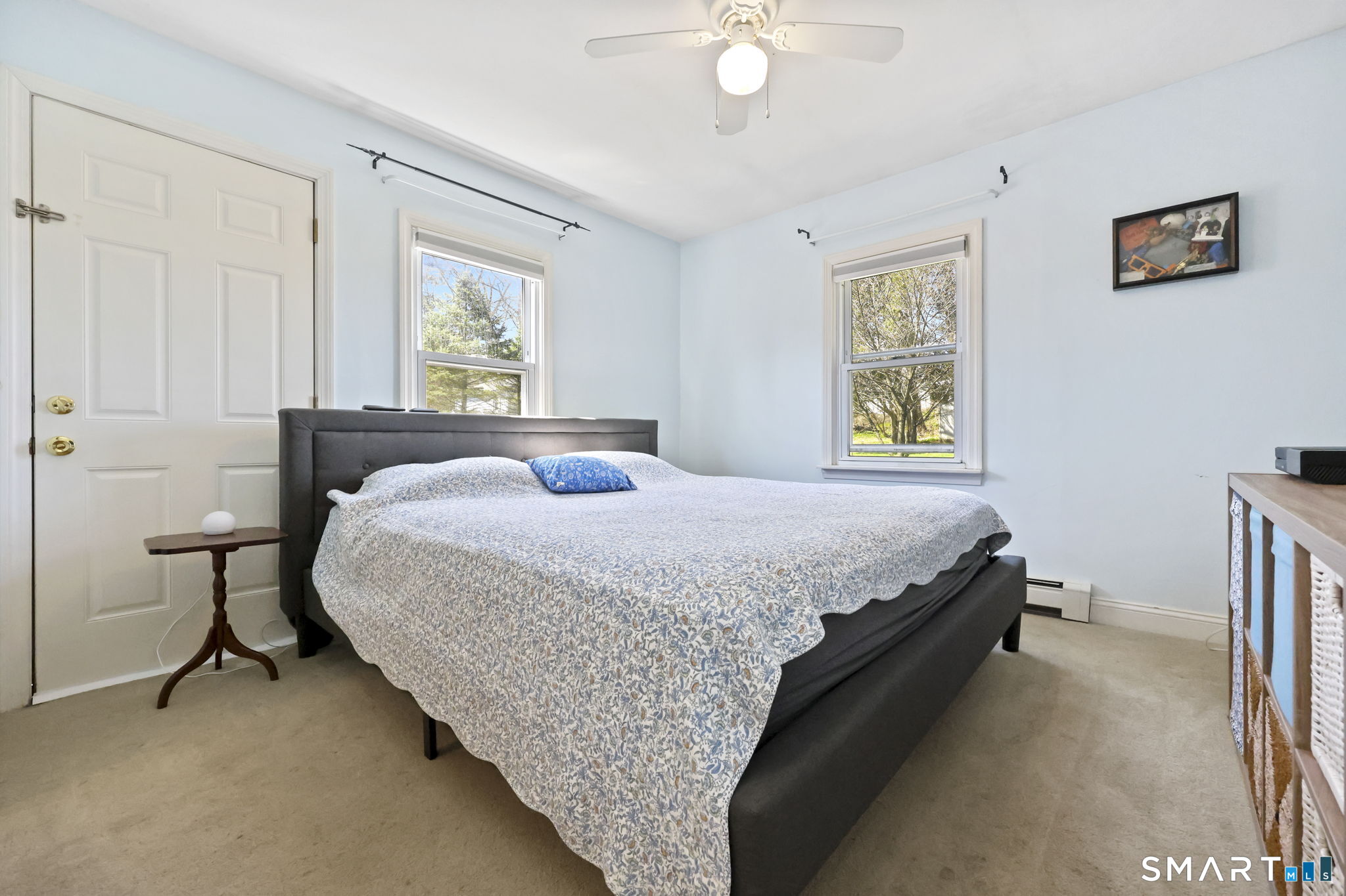 27 Lanesville Road New Milford, CT 06776 - Photo 22 of 38 a bedroom with a bed and a chandelier