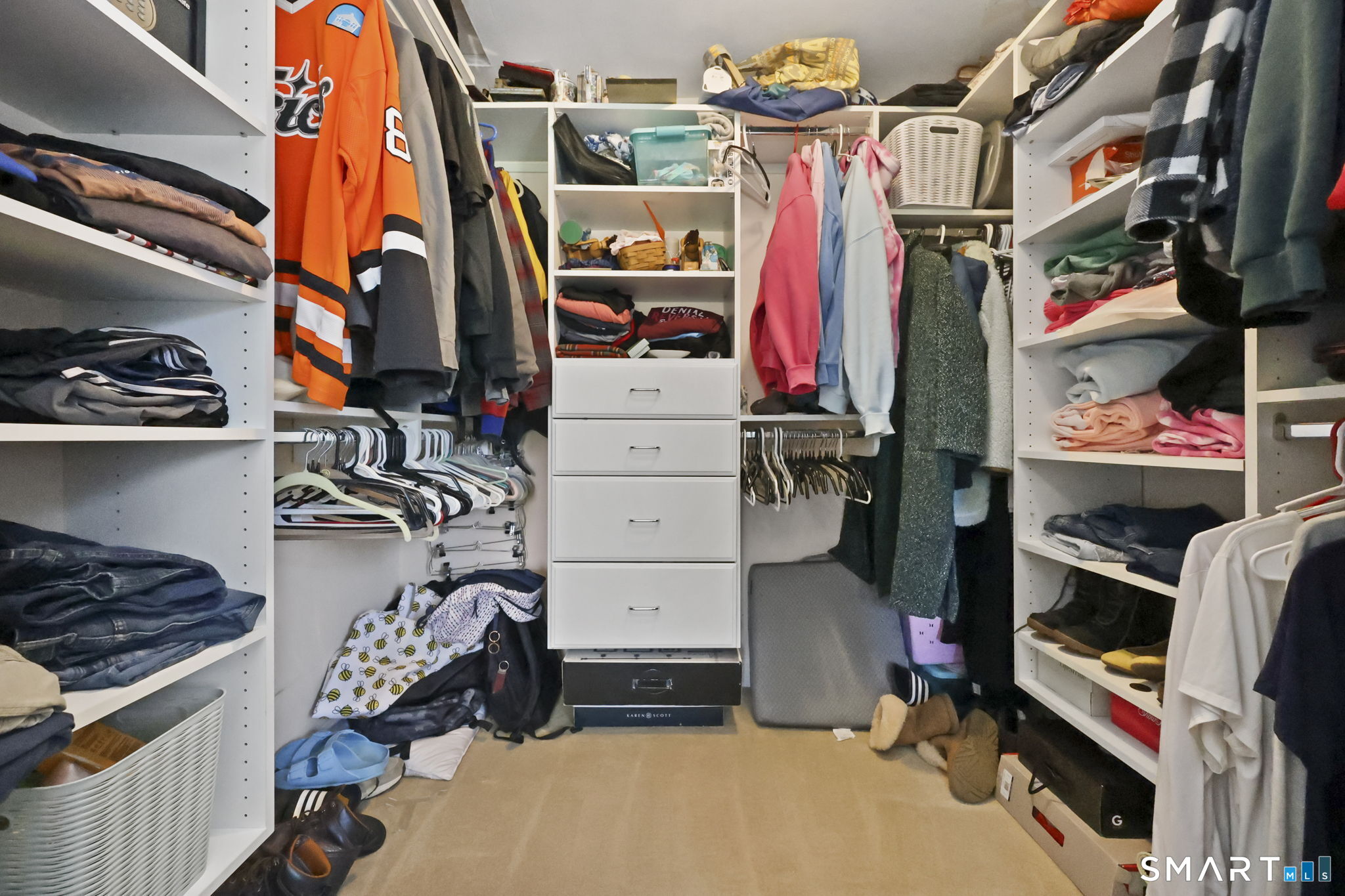 27 Lanesville Road New Milford, CT 06776 - Photo 23 of 38 a view of walk in closet with clothes and shoes