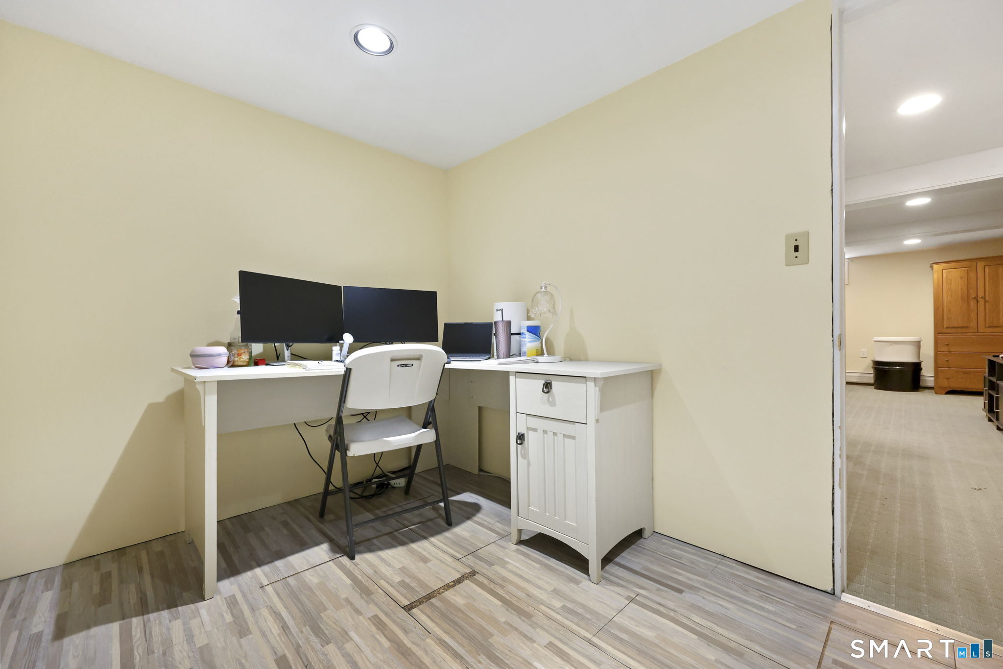 27 Lanesville Road New Milford, CT 06776 - Photo 31 of 38 a work room with furniture a flat screen tv and a wooden floor