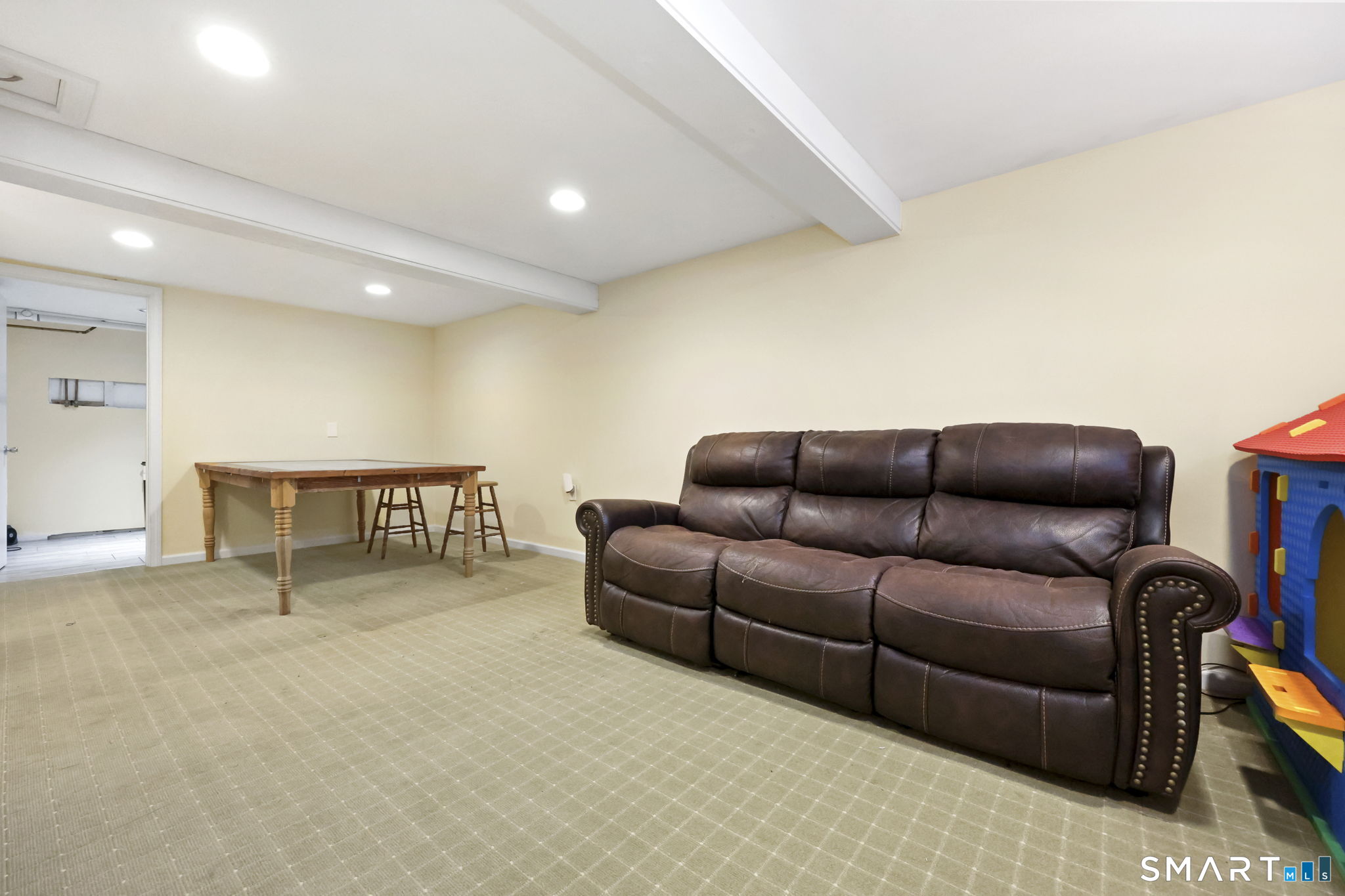 27 Lanesville Road New Milford, CT 06776 - Photo 32 of 38 a living room with furniture a ceiling fan and a rug