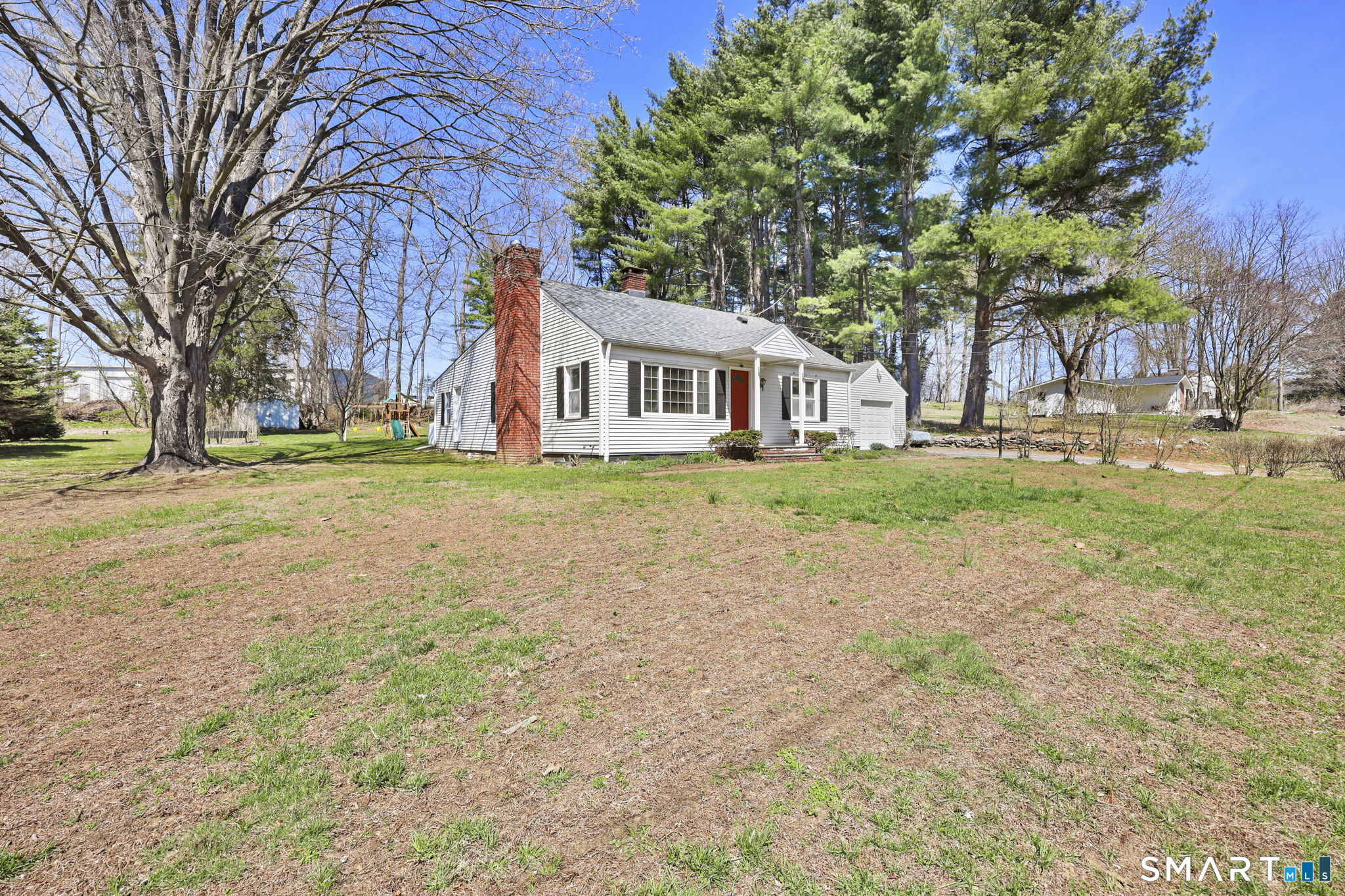 27 Lanesville Road New Milford, CT 06776 - Photo 5 of 38 a front view of a house with a yard and trees