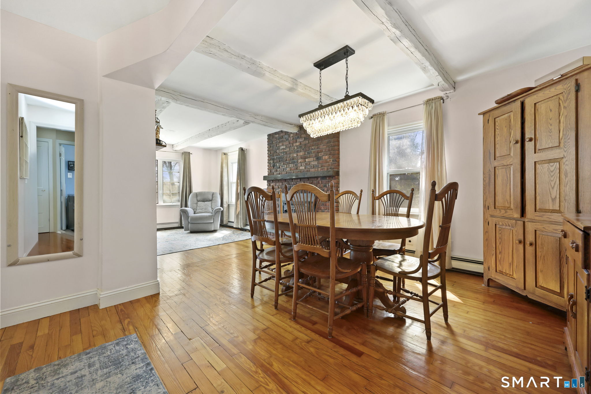 27 Lanesville Road New Milford, CT 06776 - Photo 9 of 38 a view of a dining room with furniture window and wooden floor