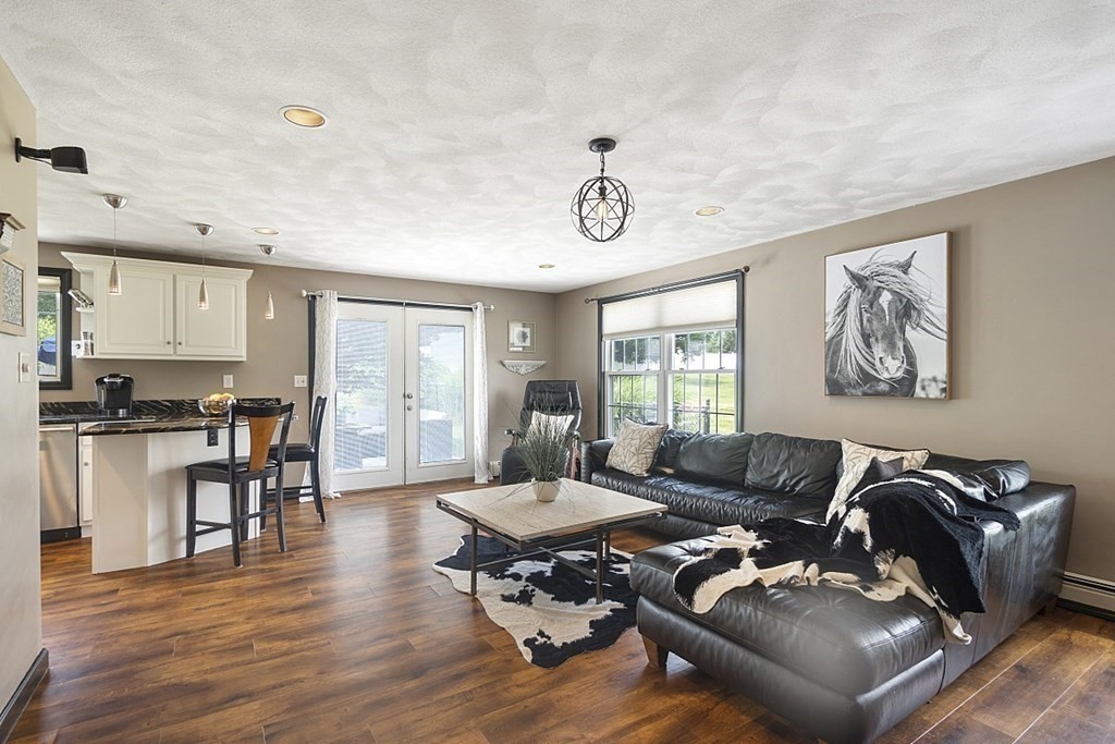 6 Violet Road Billerica, MA 01821 - Photo 13 of 42 a living room with furniture and wooden floor