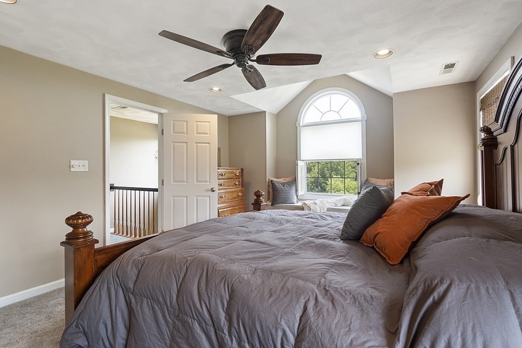 6 Violet Road Billerica, MA 01821 - Photo 20 of 42 a bed sitting in a spacious bedroom next to a window