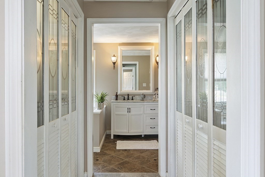 6 Violet Road Billerica, MA 01821 - Photo 21 of 42 a bathroom with a granite countertop sink and a mirror