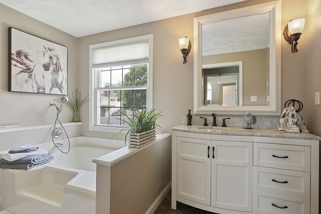 6 Violet Road Billerica, MA 01821 - Photo 22 of 42 a spacious bathroom with sinks a mirror a vanity and a window