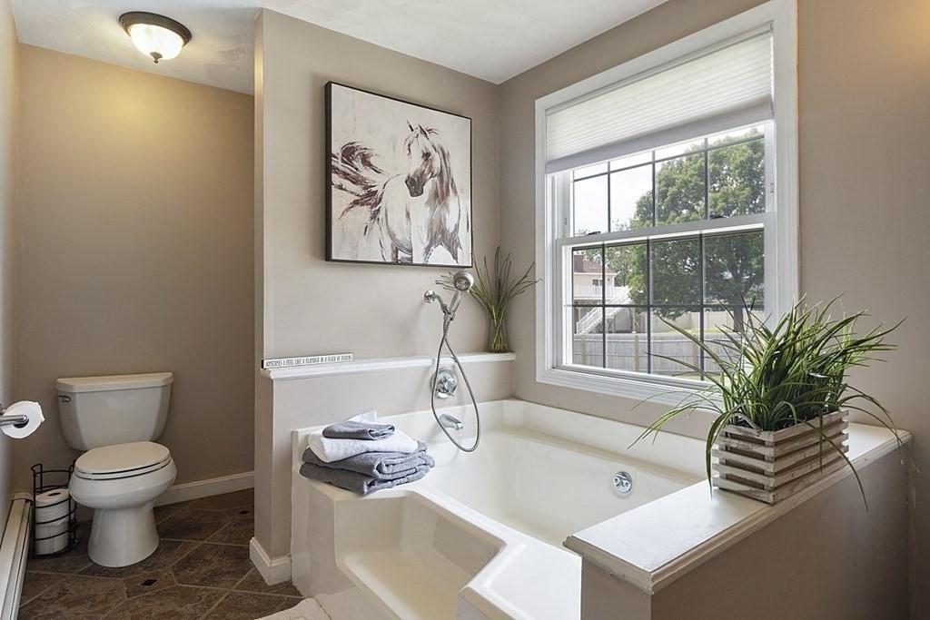 6 Violet Road Billerica, MA 01821 - Photo 23 of 42 a living room with furniture a window and a potted plant