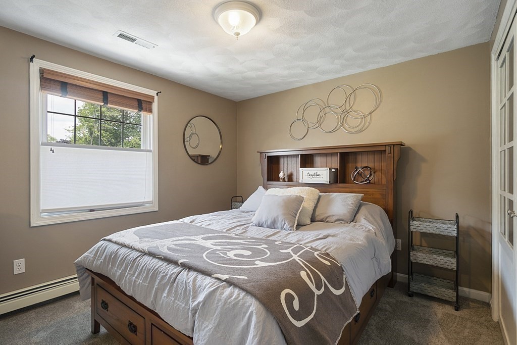 6 Violet Road Billerica, MA 01821 - Photo 26 of 42 a bedroom with a bed and a window