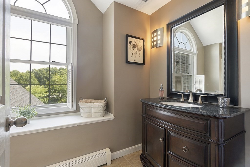 6 Violet Road Billerica, MA 01821 - Photo 28 of 42 a bathroom with a granite countertop sink mirror and window