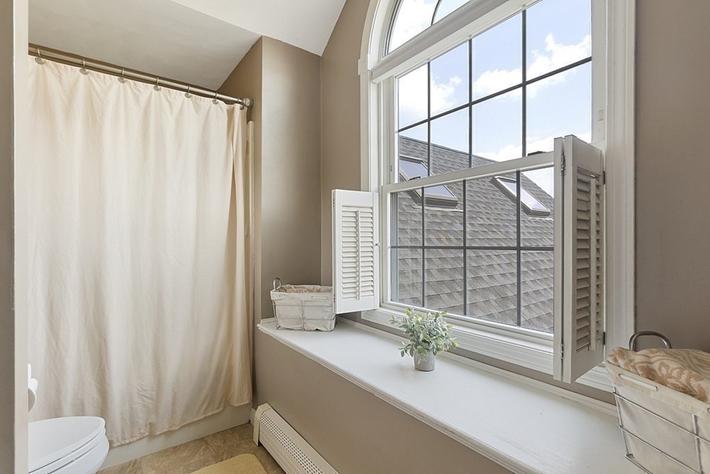 6 Violet Road Billerica, MA 01821 - Photo 29 of 42 a bathroom with a sink and a shower curtain