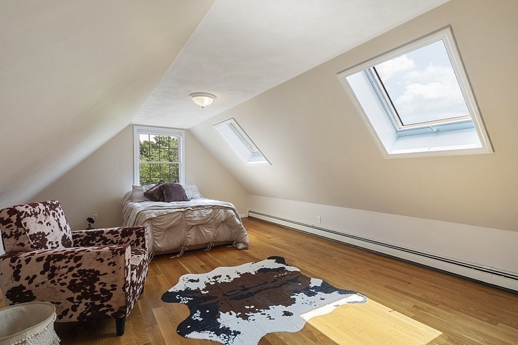 6 Violet Road Billerica, MA 01821 - Photo 30 of 42 a bed sitting in a bedroom next to a window