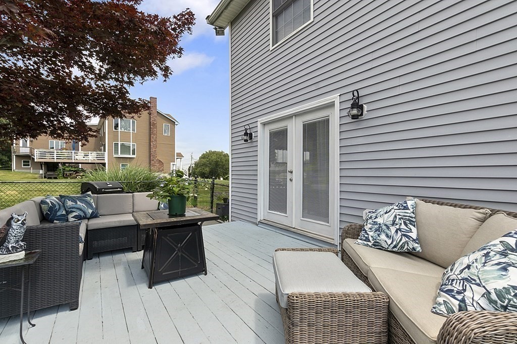 6 Violet Road Billerica, MA 01821 - Photo 32 of 42 a view of a patio with couches and potted plants