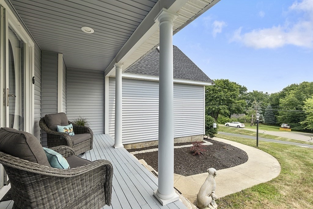 6 Violet Road Billerica, MA 01821 - Photo 33 of 42 a living room filled with furniture and a rug