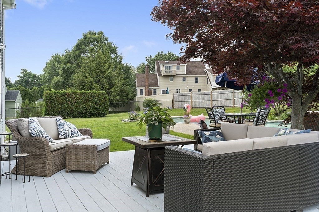 6 Violet Road Billerica, MA 01821 - Photo 35 of 42 a view of a patio with couches potted plants and a large tree