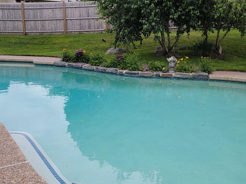 6 Violet Road Billerica, MA 01821 - Photo 37 of 42 a view of a lake with a house in the background