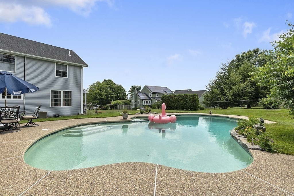 6 Violet Road Billerica, MA 01821 - Photo 38 of 42 a view of a swimming pool with lounge chairs