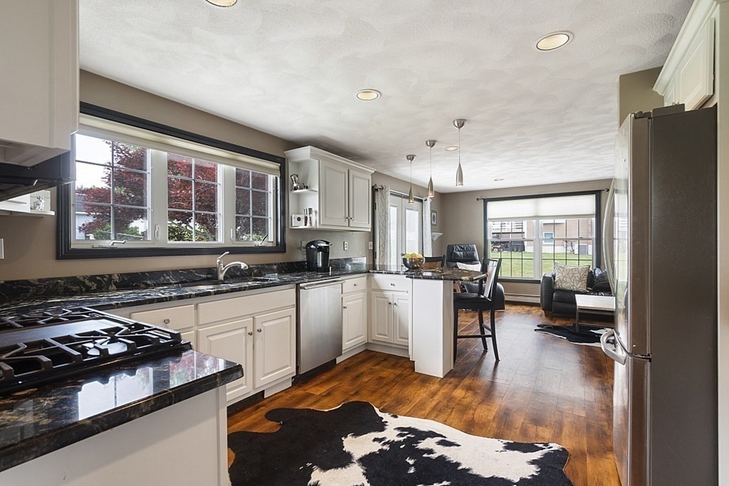 6 Violet Road Billerica, MA 01821 - Photo 9 of 42 a kitchen with sink a stove and refrigerator