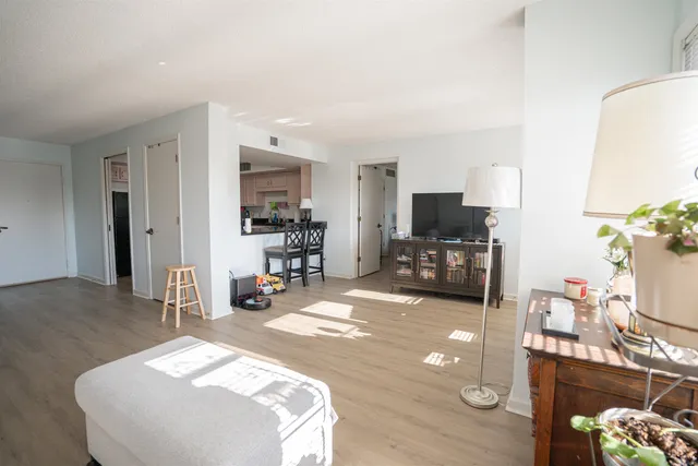 a bedroom with furniture and a flat screen tv