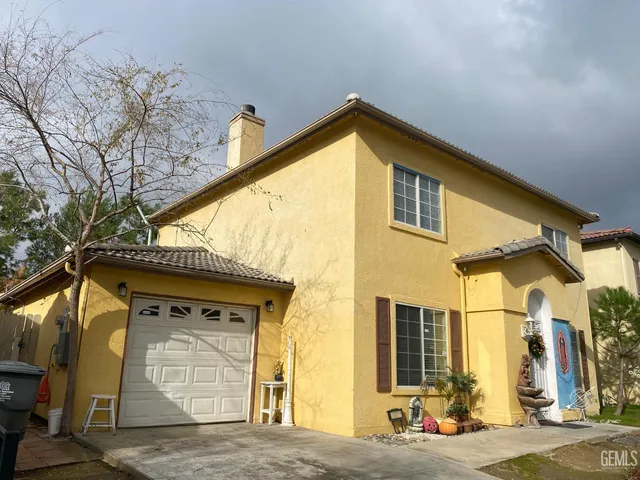 a view of a house with a street
