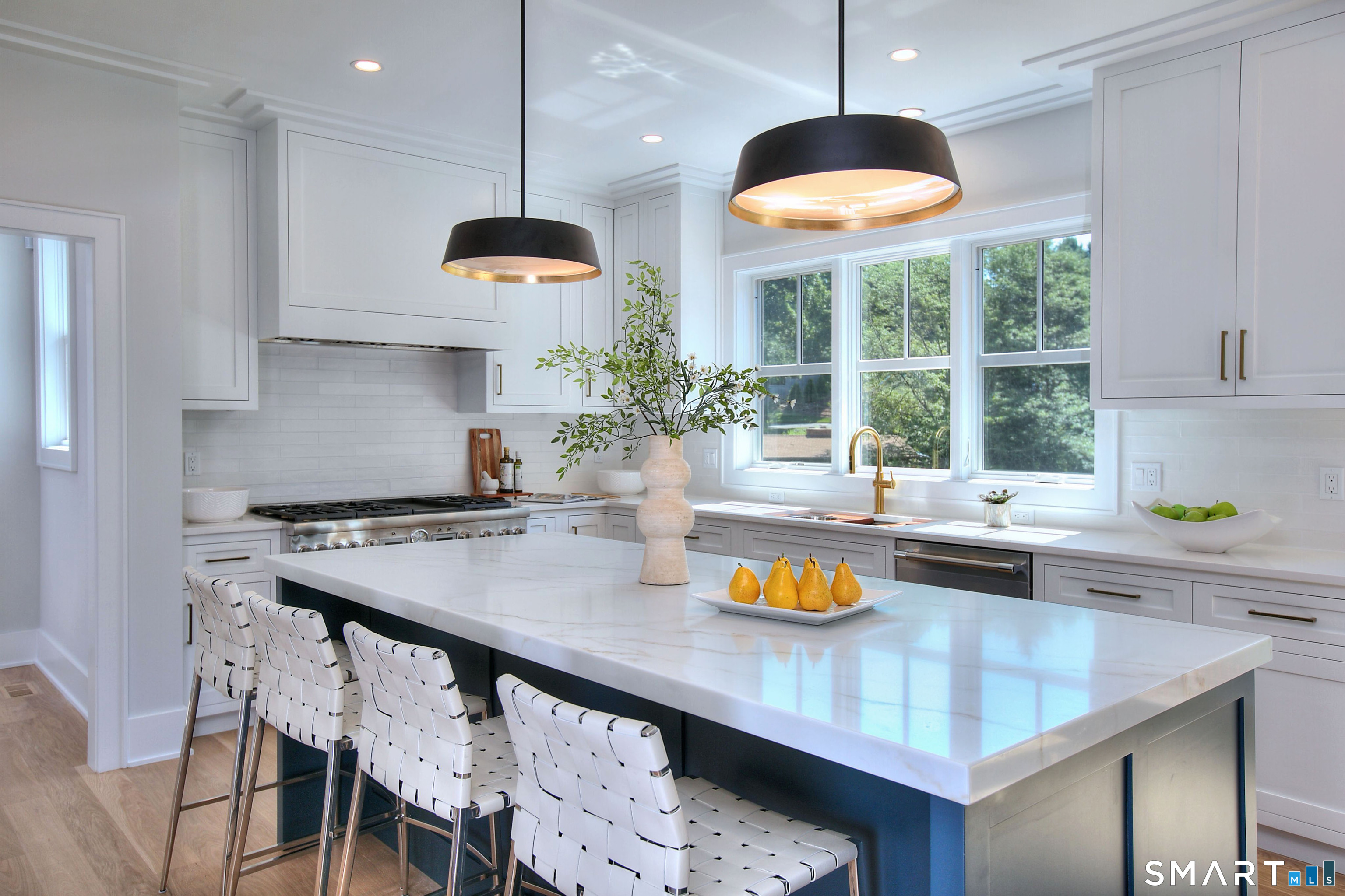 20 Fresenius Road Westport, CT 06880 - Photo 7 of 18 a kitchen with a table and chairs in it
