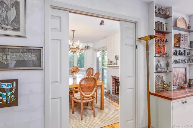 a dining room with furniture and a chandelier
