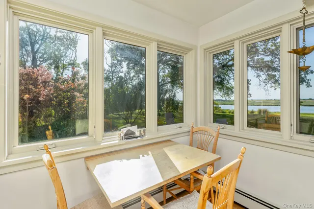 a view of a patio with a table and chairs