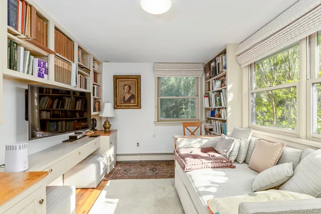 a living room with fireplace furniture and a flat screen tv
