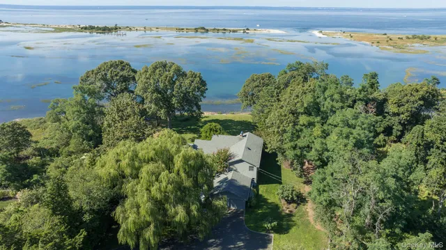 an aerial view of a houses with outdoor space