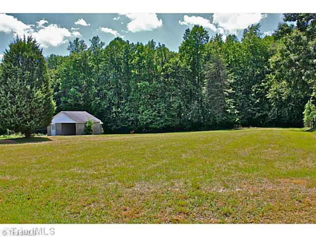 8016 Lester Road Stokesdale, NC 27357 - Photo 13 of 14 Exterior Front. Look at all this land