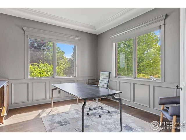 a workspace with furniture and a window